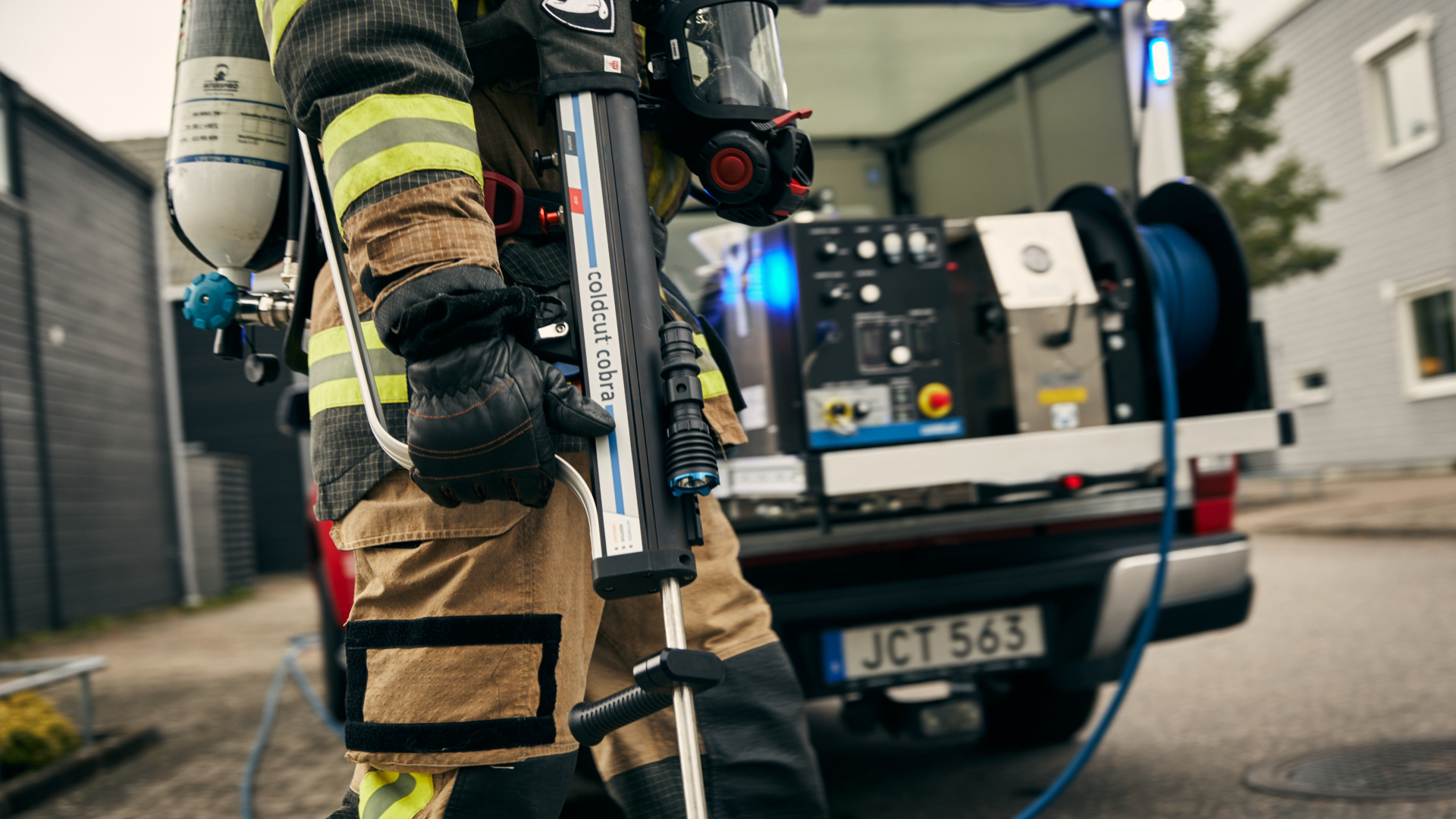 A firefighter and a fire truck with Cobra