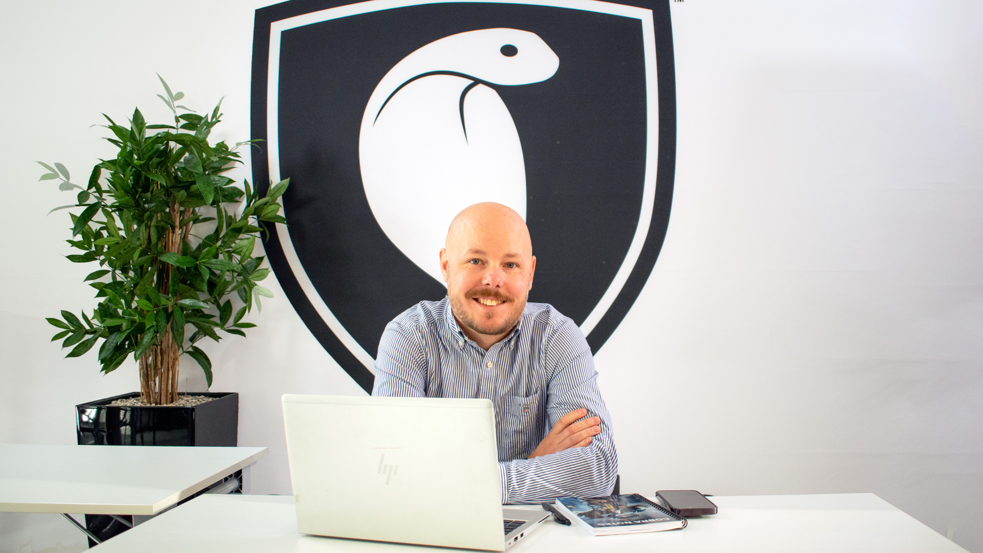 A man sitting in front of a laptop computer